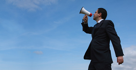 Image showing Businessman speaking with a megaphone