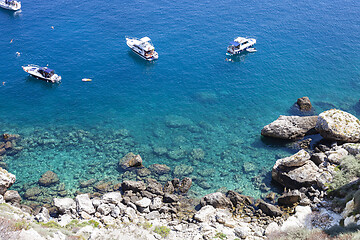 Image showing Boats near a rock stone coast. San Domino island, Italy: scenic 