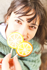 Image showing Portrait of pretty young happy woman posing with sweet lollipops