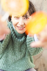 Image showing Portrait of pretty young happy woman posing with sweet lollipops