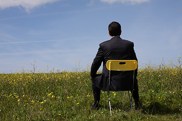 Image showing Businessman sitting in a chair