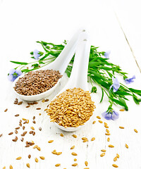 Image showing Flaxen white and brown in two spoons on wooden table