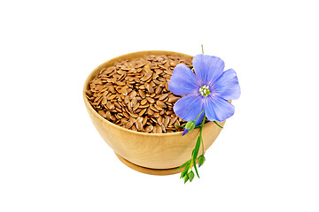 Image showing Flaxen brown seed in bowl with flower
