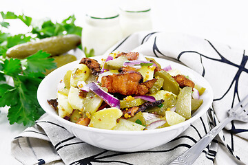 Image showing Salad potato with bacon and cucumber in plate on white board