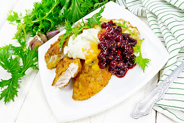 Image showing Turkey breast with cranberry sauce on table