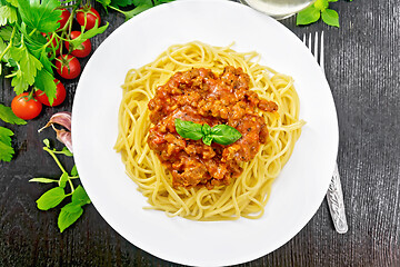 Image showing Spaghetti with bolognese on dark board top