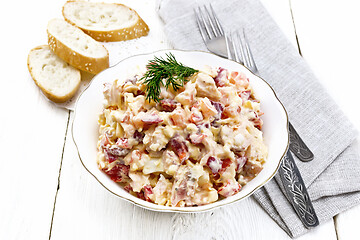 Image showing Salad with chicken and vegetables in plate on board