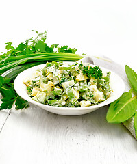 Image showing Salad with potatoes and sorrel on wooden light board