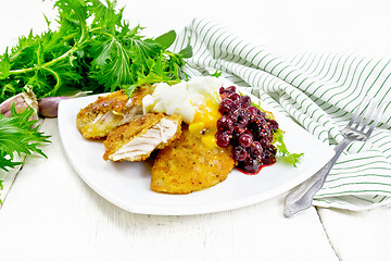 Image showing Turkey breast with cranberry sauce on light board