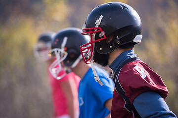 Image showing american football team with coach in action