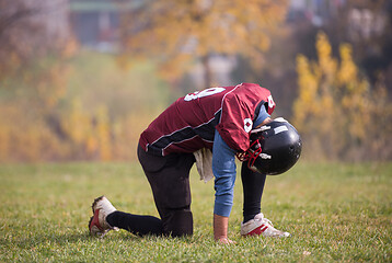 Image showing american football player resting after hard training