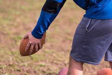 Image showing american football team with coach in action