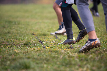 Image showing american football team exercises on ladder drills