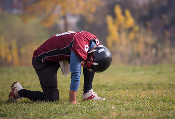 Image showing american football player resting after hard training