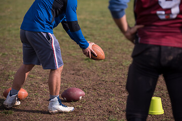 Image showing american football team with coach in action