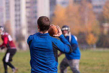 Image showing american football team with coach in action