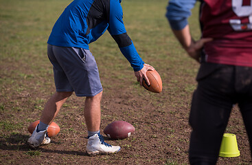 Image showing american football team with coach in action