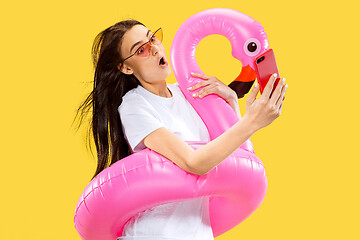 Image showing Portrait of beautiful woman isolated on yellow studio background