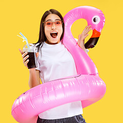 Image showing Portrait of beautiful woman isolated on yellow studio background