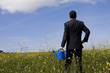 Image showing businessman with a flowerpot