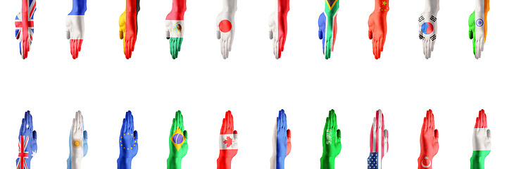 Image showing Hands colored in flags of participating countries of The Group of Twenty