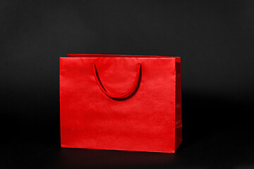 Image showing red shopping bag on black background