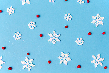 Image showing white snowflakes and berries on blue background