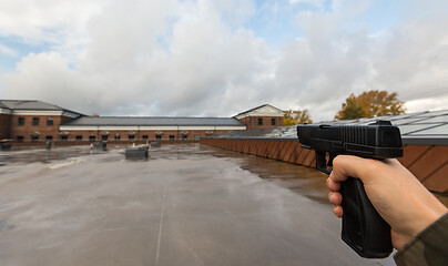 Image showing POV of male hands shooting with semi-automatic gun