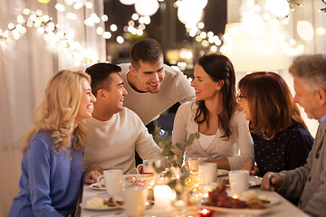 Image showing happy family having tea party at home