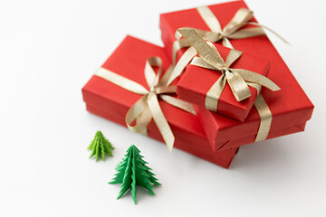 Image showing gift boxes and christmas trees on white background