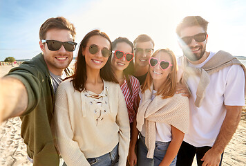 Image showing happy friends taking selfie on summer beach