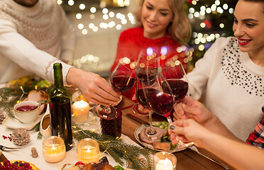 Image showing close up of friends with wine celebrate christmas