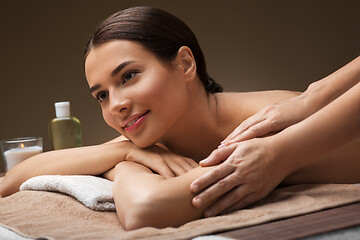 Image showing woman lying and having massage at spa