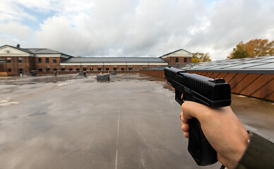 Image showing POV of male hands shooting with semi-automatic gun