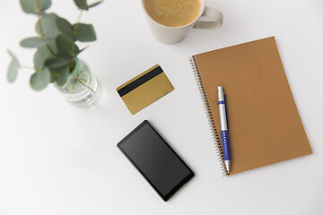 Image showing smartphone, credit card, notebook and coffee