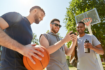Image showing men with smartphone on basketball playground
