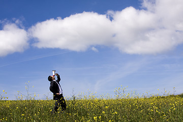 Image showing Businessman speaking with a megaphone