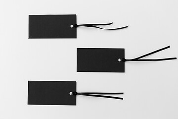 Image showing three black tags on white background