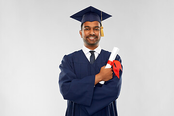 Image showing male graduate student in mortar board with diploma