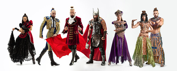 Image showing Bright fairy tale characters in costumes in front of white background