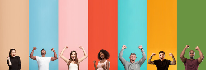 Image showing Young attractive people looking astonished on multicolored background