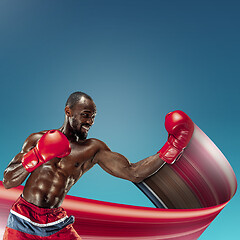 Image showing Young african-american athlete training over blue background