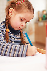 Image showing Cute little girl painting