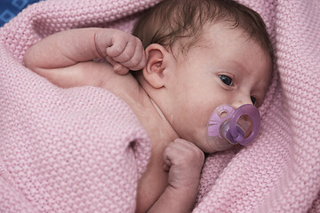 Image showing One month newborn baby sleeping in bed