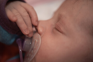 Image showing One month newborn baby sleeping in bed