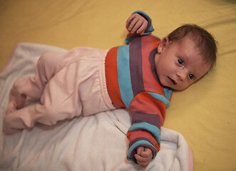 Image showing One month newborn baby sleeping in bed