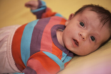 Image showing One month newborn baby sleeping in bed