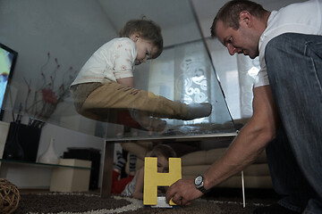 Image showing Little child playing with sister at home