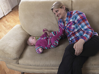 Image showing grandmother is playing with newborn baby