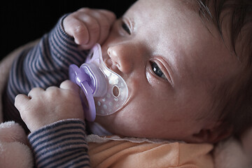 Image showing One month newborn baby sleeping in bed